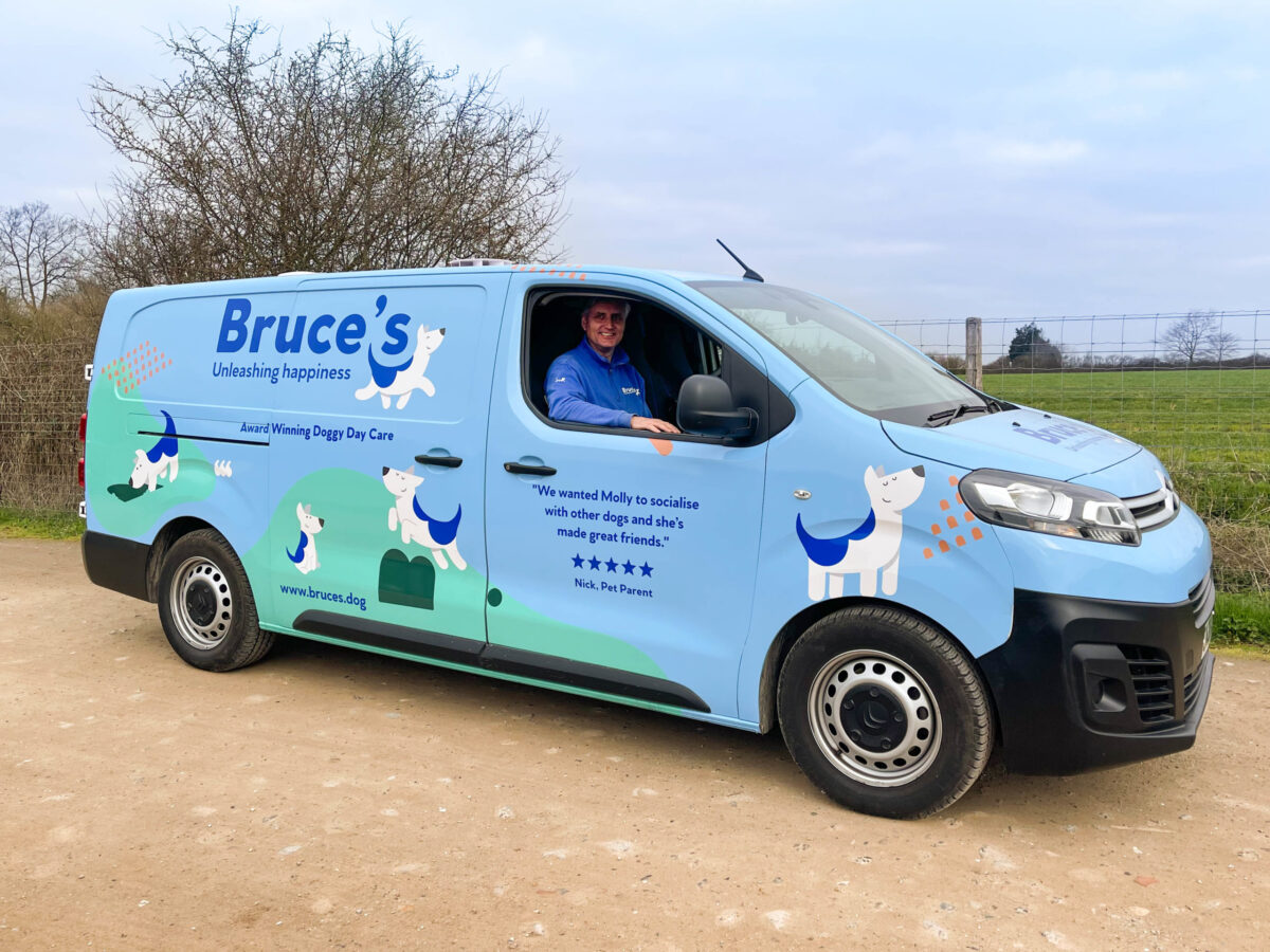 Doggy bus driver driving the Bruce's doggy day care van