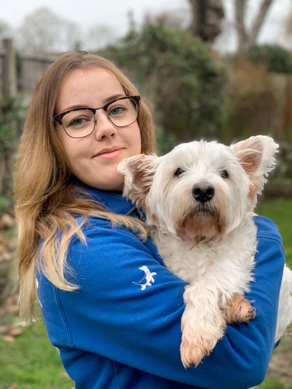 Alisha Dog day care manager with west highland terrier