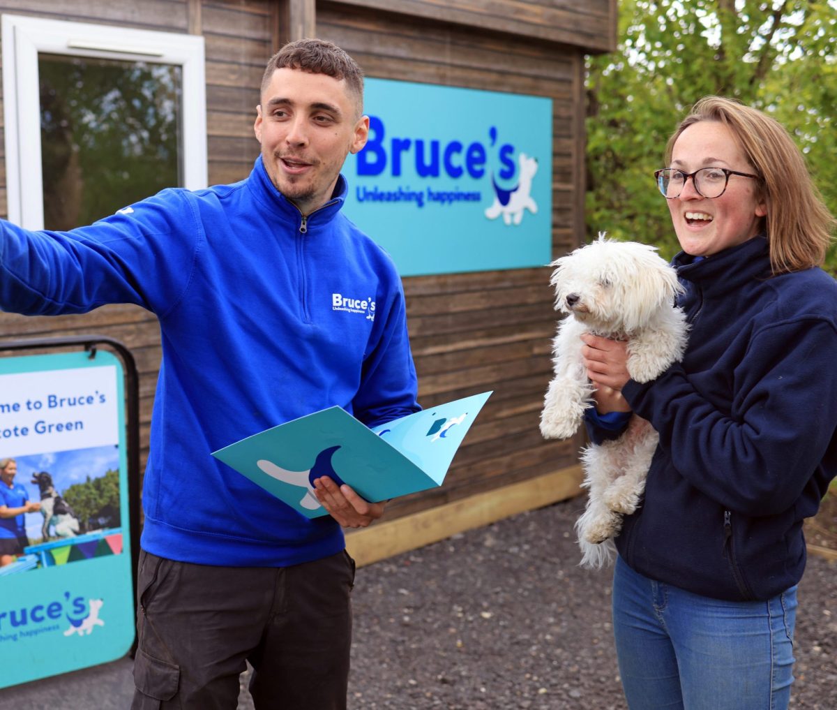 Dog owner and maltipoo having a welcome meeting at doggy day care in Woodcote Green