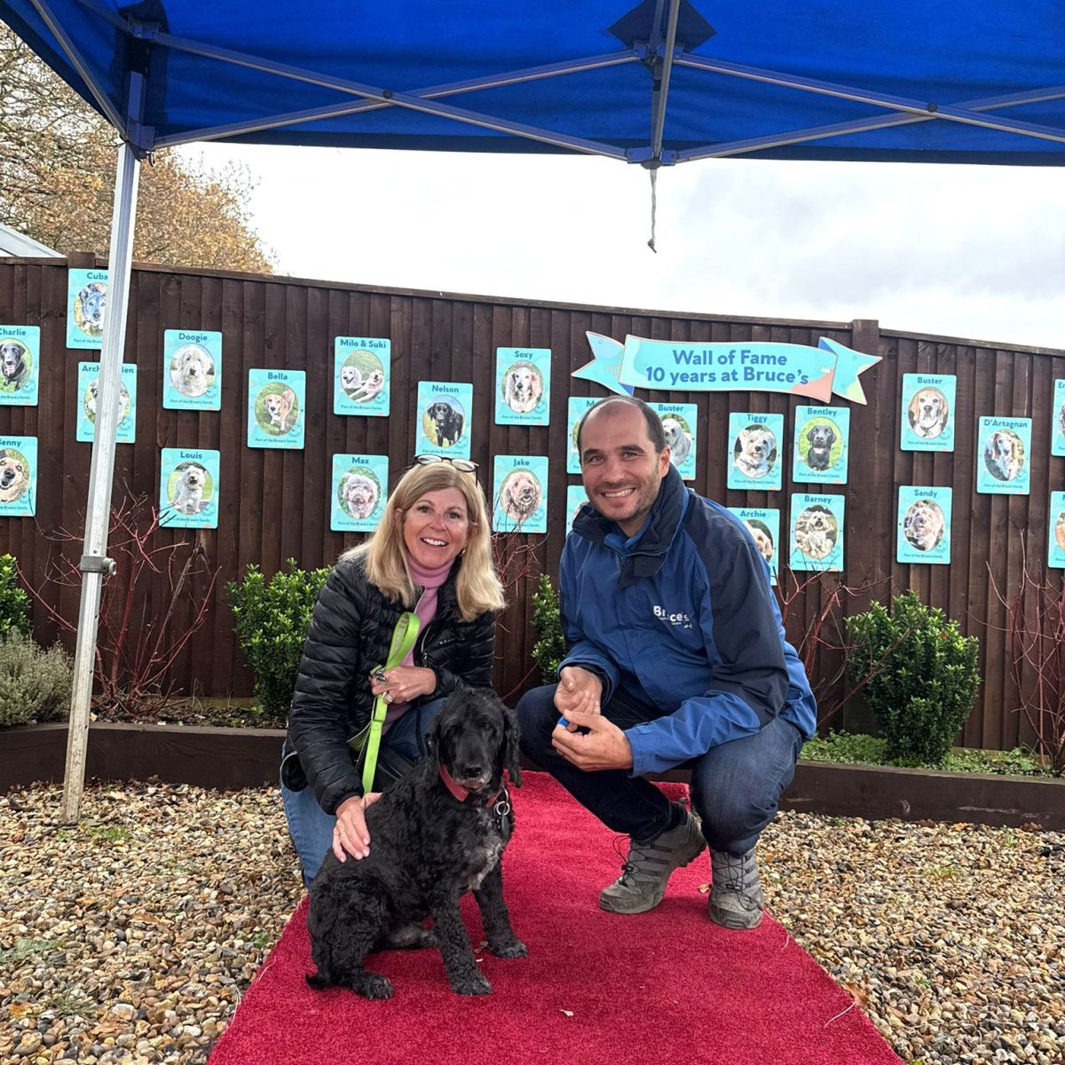 bruce with dog and owner on red carpet