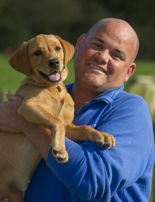 Alex with lab puppy